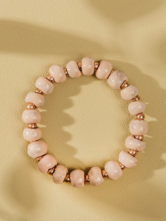 Pink and gold ceramic bead bracelet.